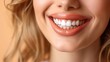 © Ghiska - Close up portrait of beautiful woman smiling with white teeth and healthy lips on beige background.