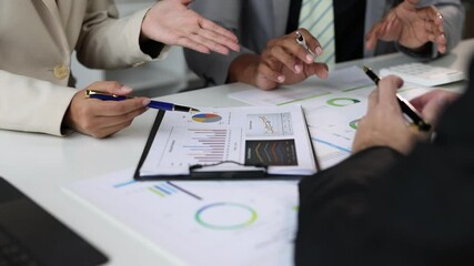 Wall Mural - Businessman meeting with colleagues, discussing the sales situation and making a marketing plan. Brainstorming, discussing financial analysis and planning business strategies.