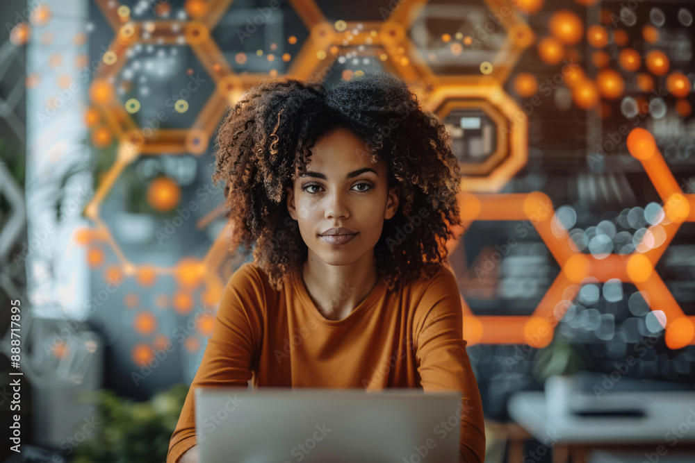 An individual sits at an office desk, surrounded by digital hexagons ...