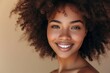 © LimeSky - Portrait of a smiling beautiful afro girl with clean healthy skin on beige background