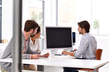 Wall Mural - Making sure we are all on the same page. Portrait of a diverse group of businesspeople sitting in an office.