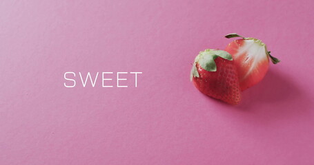 Wall Mural - Image of sweet text over halved strawberry on pink background