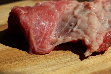 cut of raw beef meat a wood on wooden cutting plate