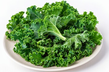 Wall Mural - Top view of green kale leaves on white plate healthy vegetarian option