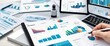 © Qbertstudio - Business desk with tablets, laptop, and papers showcasing data charts and graphs, ideal for business analysis, reporting, financial planning, and strategic planning