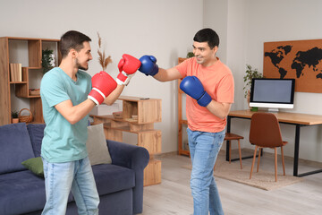 Wall Mural - Young brothers boxing in living room