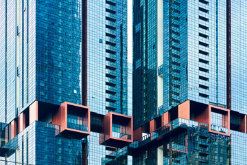 Canvas Print - Modern architecture facade reflecting blue sky in kuala lumpur malaysia