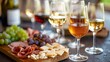© Klnpherch - Elegant wine tasting event with glasses of red and white wine, charcuterie board, sophisticated and luxurious setting