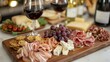 © Klnpherch - Elegant wine tasting event with glasses of red and white wine, charcuterie board, sophisticated and luxurious setting