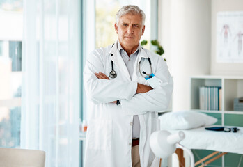 Poster - Arms crossed, healthcare and portrait of mature doctor in hospital for appointment or checkup. Cardiology, medical and trust with confident medicine professional in clinic for consulting or treatment