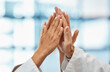 © peopleimages.com - Hands, doctors and high five in celebration with support for collaboration, surgery success and healthcare win. Medical team, trust and palm connection for achievement, solidarity and goals in clinic