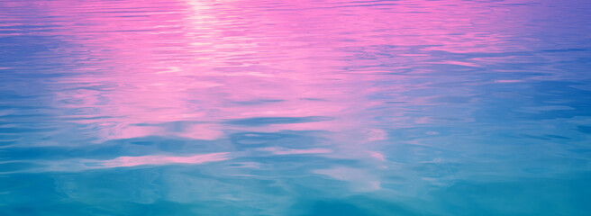 Canvas Print - Sea water surface. View from above. Artistic pink-blue gradient color. Horizontal banner