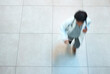 © Oostendorp/peopleimages.com - Woman, doctor and above with rush for emergency surgery, medical appointment or urgent attention. Top view of female person or healthcare employee running in motion blur for deadline at busy clinic
