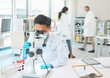 © Oostendorp/peopleimages.com - Microscope, vials and man scientist in laboratory with blur motion for dna, blood test or rna analysis. Biotechnology, research and hematologist with glass tubes for medical innovation discovery.