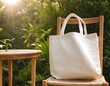 © mudasar - A blank white tote bag hangs on the back of a wooden chair in a garden setting, perfect for showcasing designs, branding, or promoting eco-friendly products.