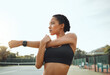 © KayJoint/peopleimages.com - Outdoor, fitness and woman with stretching arm for morning exercise, thinking or workout routine. Sport, athlete and female person in thought for match, preparing or warm up muscles on tennis court