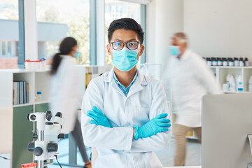 Canvas Print - Laboratory, mask and man in portrait with arms crossed, planning and investigation for medical virus. Healthcare, asian doctor and confident with face cover, gloves or safety for staff in motion blur