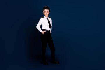 Poster - Full body photo of attractive senior woman passenger cool plane captain dressed aviator uniform isolated on dark blue color background