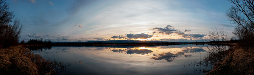 Wall Mural - Panorama lake view in sunrise time .Sunrise at the lake