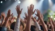 © Marko - crowd of people are raised hands in the air on concert