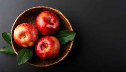 Poster - Apple in a bowl on a black background, top view, copy space