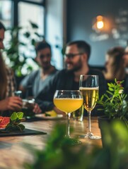 A group of people sitting around a wooden table with diverse backgrounds and expressions