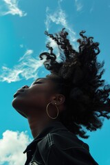 Canvas Print - A person outdoors with long hair being blown by the wind