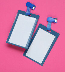 Wall Mural - ID badges on pink background. Top view