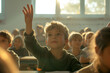 © Alina - Eager young student raising his hand in a sunlit classroom, back to college