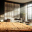 © magdal3na - Wooden table top with blurred modern home interior and empty space for products.
