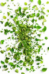 A pile of fresh green leaves on a white surface, often used for decoration or as a symbol of nature