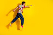 © deagreez - Full body portrait of nice funky young man run jump empty space wear shirt isolated on vibrant yellow color background