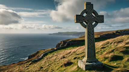 A stone Celtic cross stands overlooking the Irish coastline.