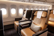 © Vitalii - Modern passenger airplane business class cabin interior