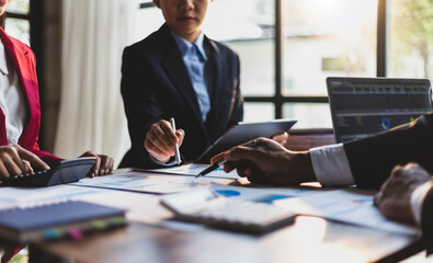 Business meeting, Company executives meeting discussing strategic analysis and business planning, group of people working with paperwork on a board room table at a business presentation or seminar.