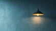© Blackmint Studio - A single lightbulb hangs from a cord, illuminating a blue wall with a soft, warm glow