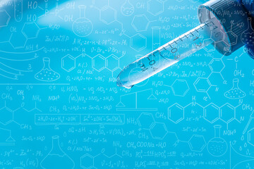 Wall Mural - science blue glass tube experiment,flask in scientist hand with test tubes,laboratory glassware with