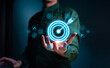 © teerawat - Businessman with target arrow virtual digital technology icon, business investment objectives and goals Marketing strategies and goals for success.