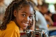 © Maxim Borbut - Young African American child holding robotic car looking at camera in STEM class. Portrait. Engineering and coding, stock photo.