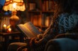 © woters - Woman reading book in cozy living room at night