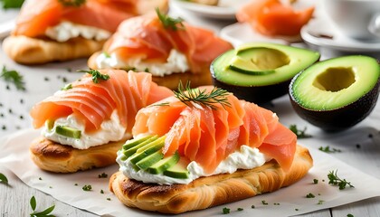 Wall Mural - Smoked salmon with cream cheese and avocado slide on fresh croissants.
