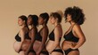 © liliyabatyrova - A group of women are standing in a row, all wearing black lingerie