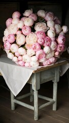 Wall Mural - Big beautiful pink and white peonies flowers on old table in rustic indoors