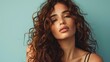 © shooreeq - 25 year old latina woman with gorgeous twisted curls, long hair coming down from shoulders, posing on pastel mono color solid background