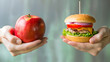 © Maksym - A healthy apple in one hand and an unhealthy burger in the other, representing the dietary dilemma of choosing between nutrition and convenience.