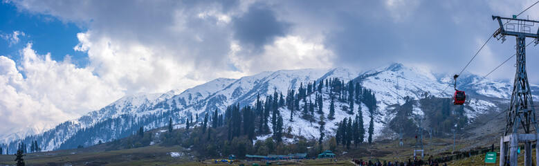 Wall Mural - View of Apharwat Peak from Gulmarg Gondola ropeway at Kongdoori, Gulmarg, Jammu and Kashmir, India. Gulmarg Gondola is one of the highest in the world reaching 3,979 metres above sea level.