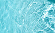 © Miha Creative - Aqua  liquid colored clear water surface texture with splashes bubbles with copy space. Water waves in sunlight background.