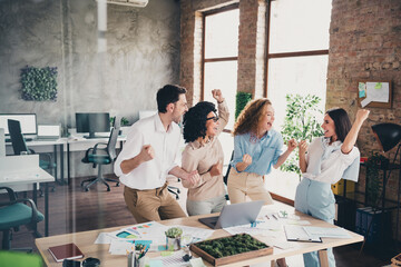 Poster - Portrait of group professional corporate workers shout yeah raise fists loft interior business center indoors