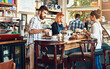 © Penn/peopleimages.com - Barista, woman and cafe as waitress in small business with customer in restaurant or coffee shop. Working people, cafeteria and client for food service with entrepreneur in startup in New York City