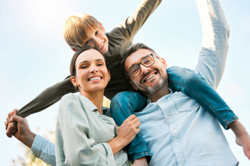 Sticker - Family, portrait and boy on shoulder in outdoor for bonding, happiness and playful for childhood fun on weekend break. Mother, father and male child together in park for sunshine, play and love.